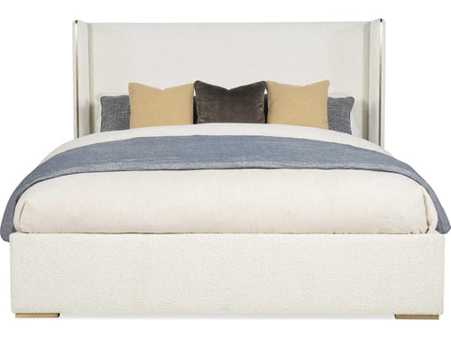 Cadence Upholstered Wing King Bed with Antique Brass Trim